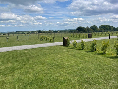 Touring caravan pitch with picnic bench